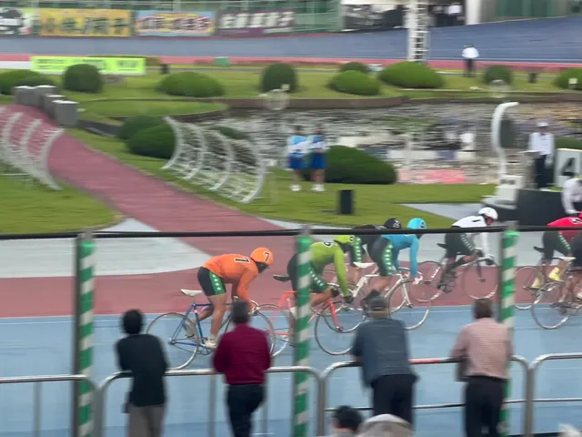 Keirin riders on a velodrome